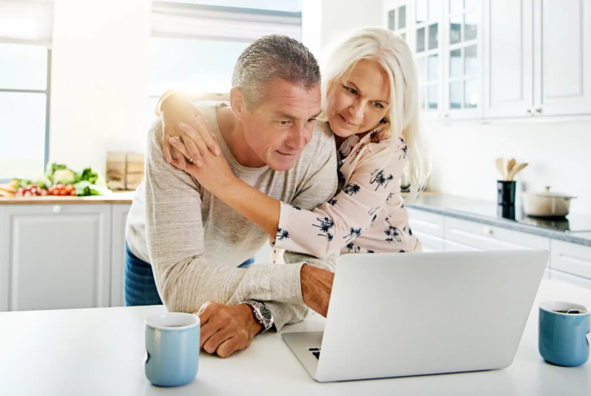 Understanding Hearing Loss couple looking at laptop